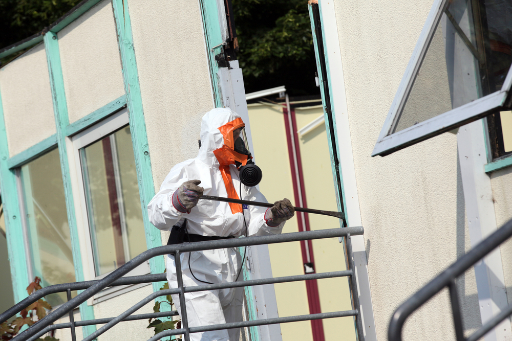 A man in asbestos suit for asbestos removal and demolition